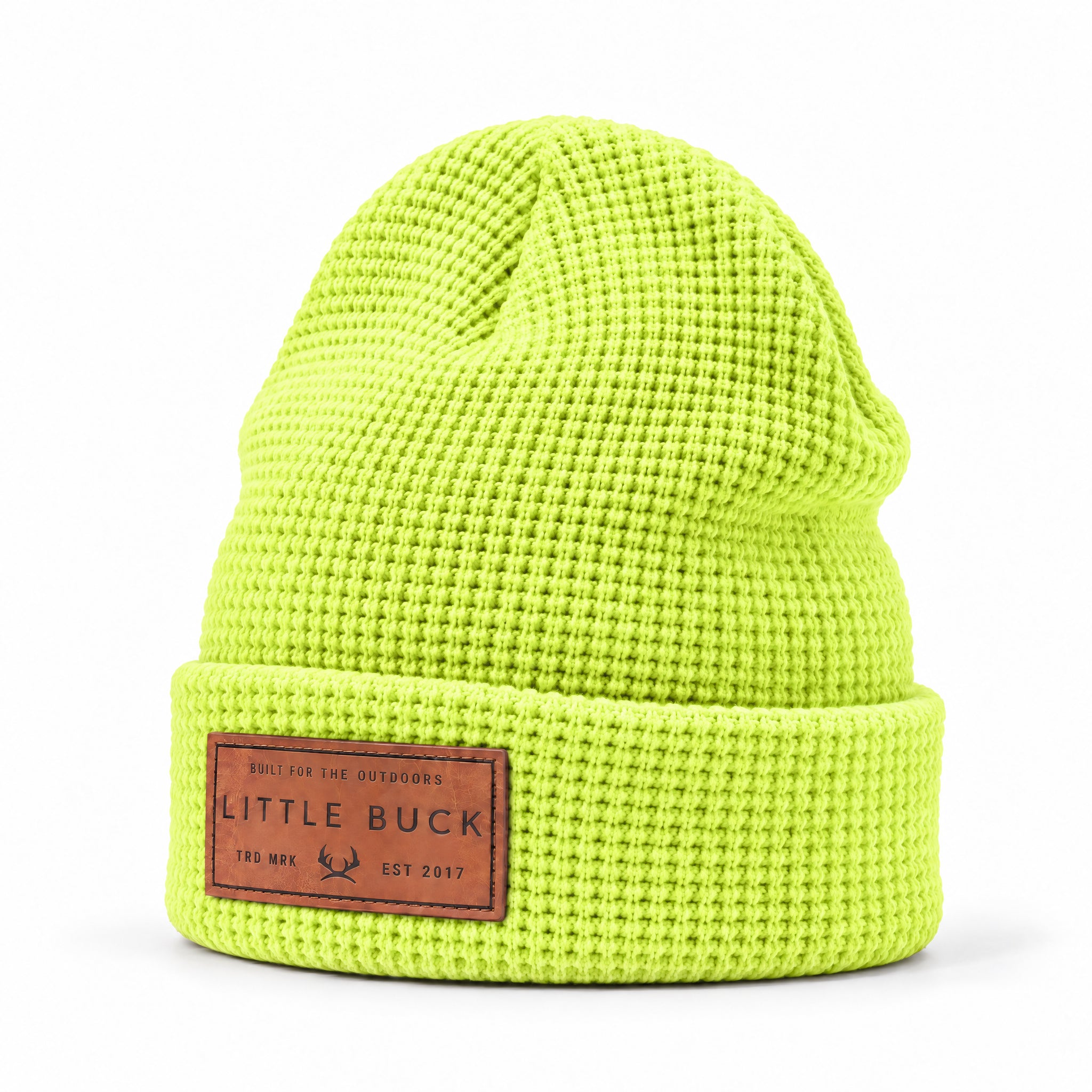 A bright neon yellow-green waffle-knit beanie hat with a brown leather patch on the front cuff reading 'LITTLE BUCK'.